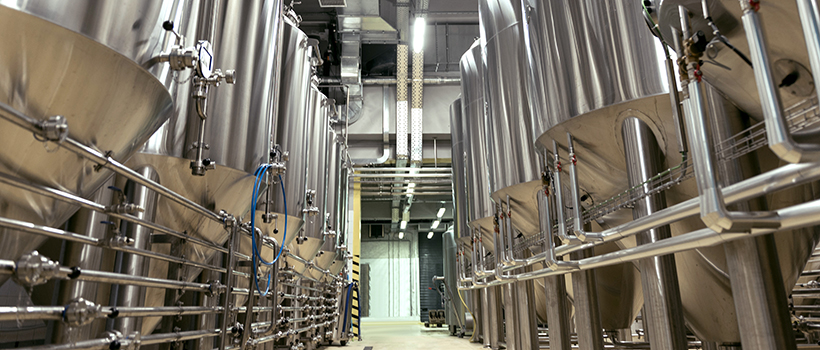 Large stainless steel brewing tanks in brewery