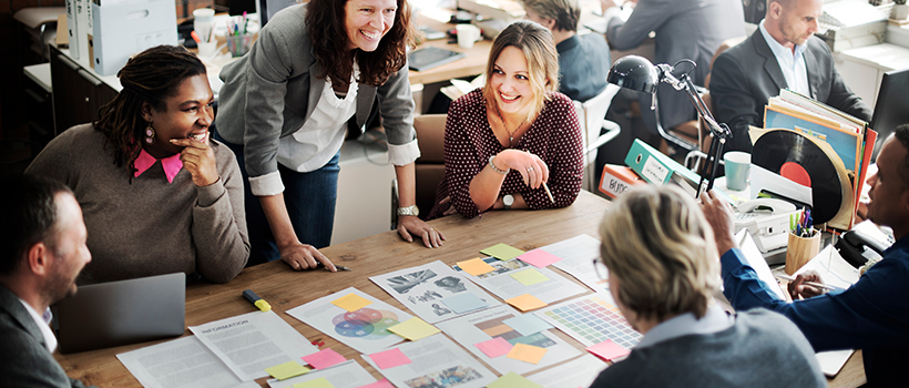 Employees at team meeting discussing strategy