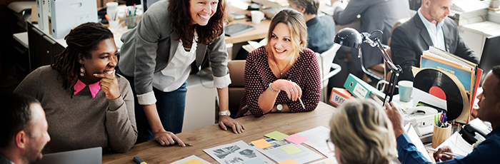 People engaging and meeting around a table