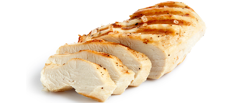 Grilled sliced chicken breast on white background