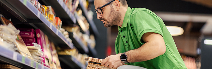 Consumer checking products on shelf