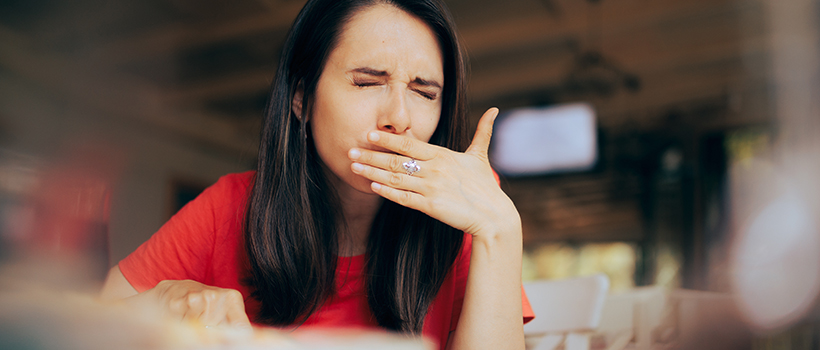 Woman eating food product discovering bad taste in mouth