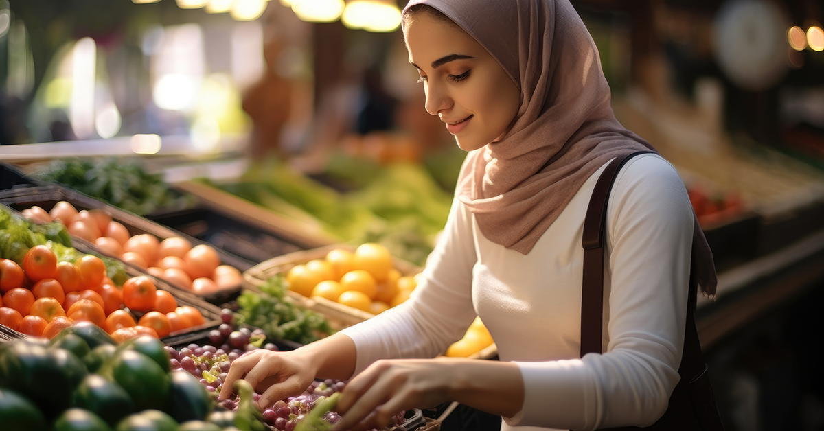 Woman selecting fruit in a supermarket