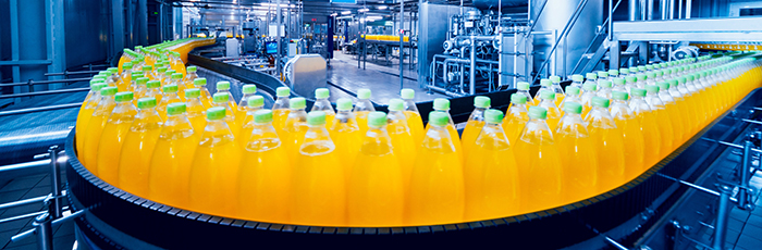 Orange juice on a production line in food and drink factory