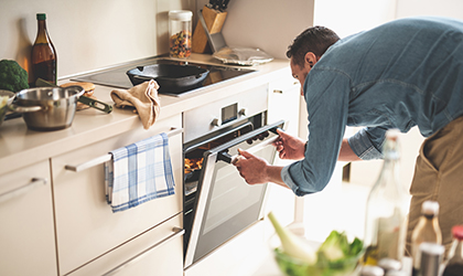 Man cooking with oven