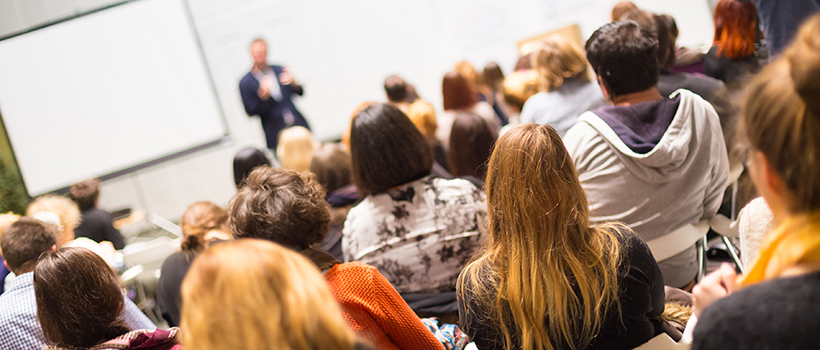 Speaker presenting to audience