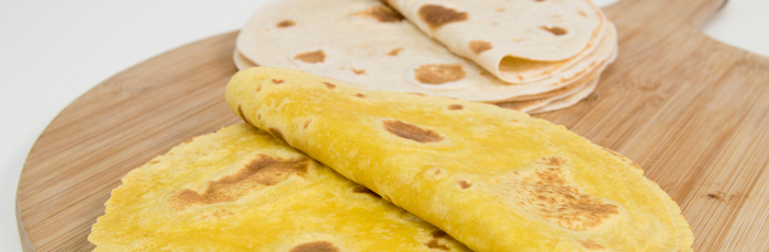 Selection of tortilla wraps on serving board