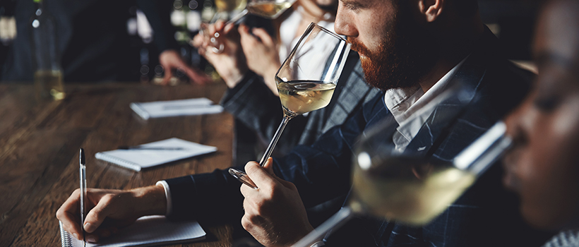Sensory panelists taste testing wine