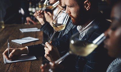 Sensory panelists taste testing wine