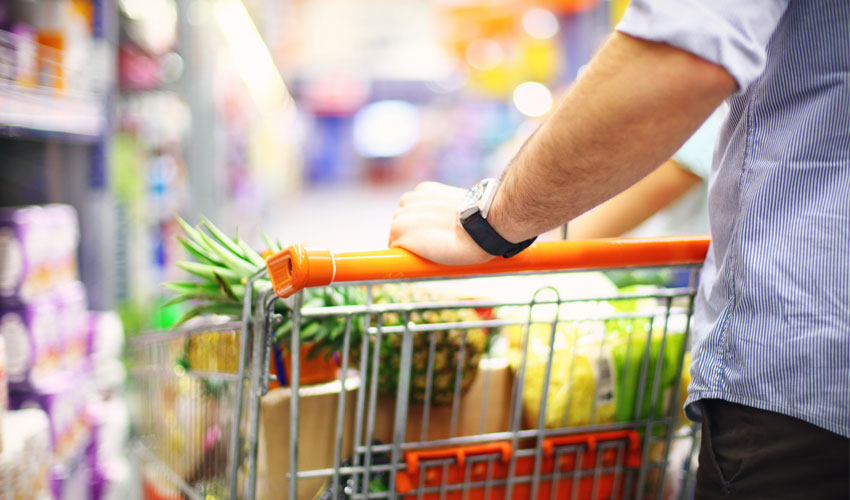 Consumer shopping with trolley